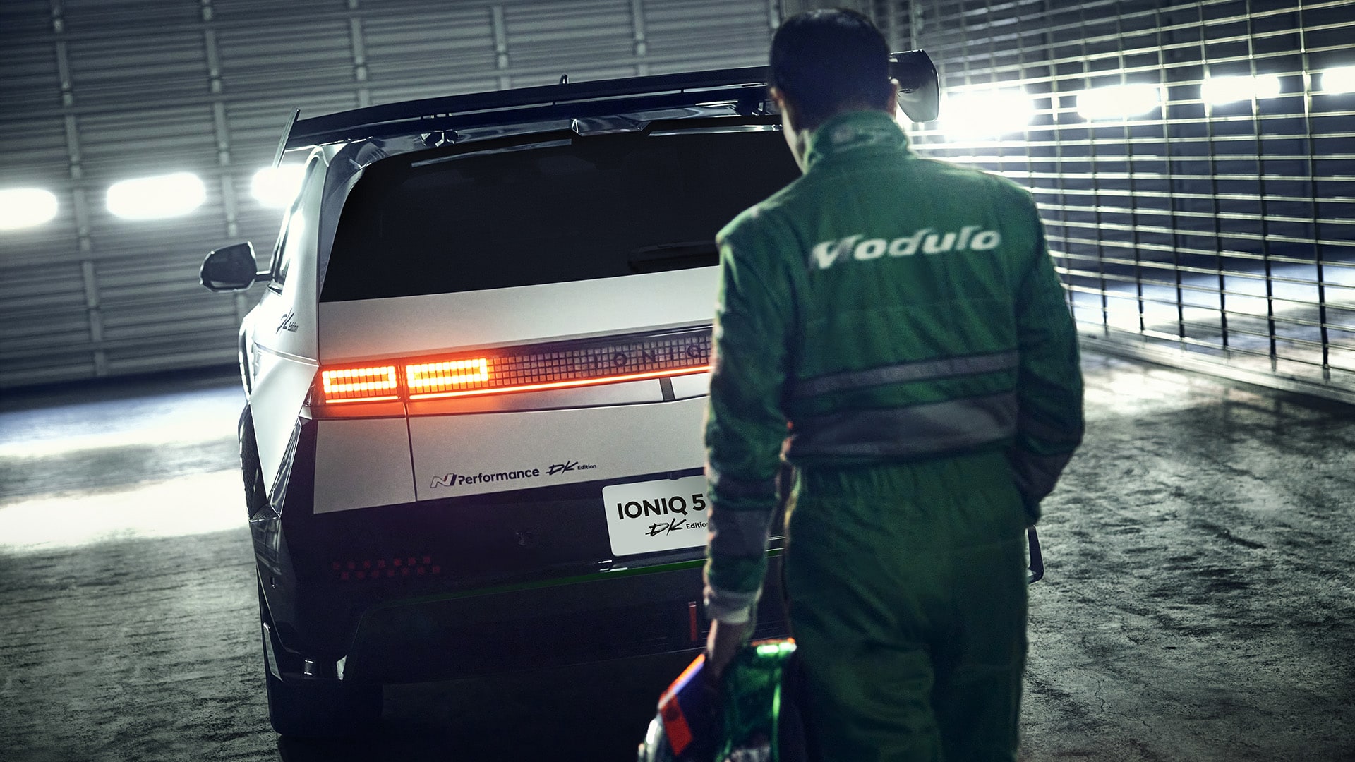 Photo image of a driver approaching the rear of an IONIQ 5 N DK Edition Limited Package parked in a garage